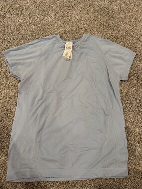 ATHLETA GIRL LIGHT BLUE SHIRT